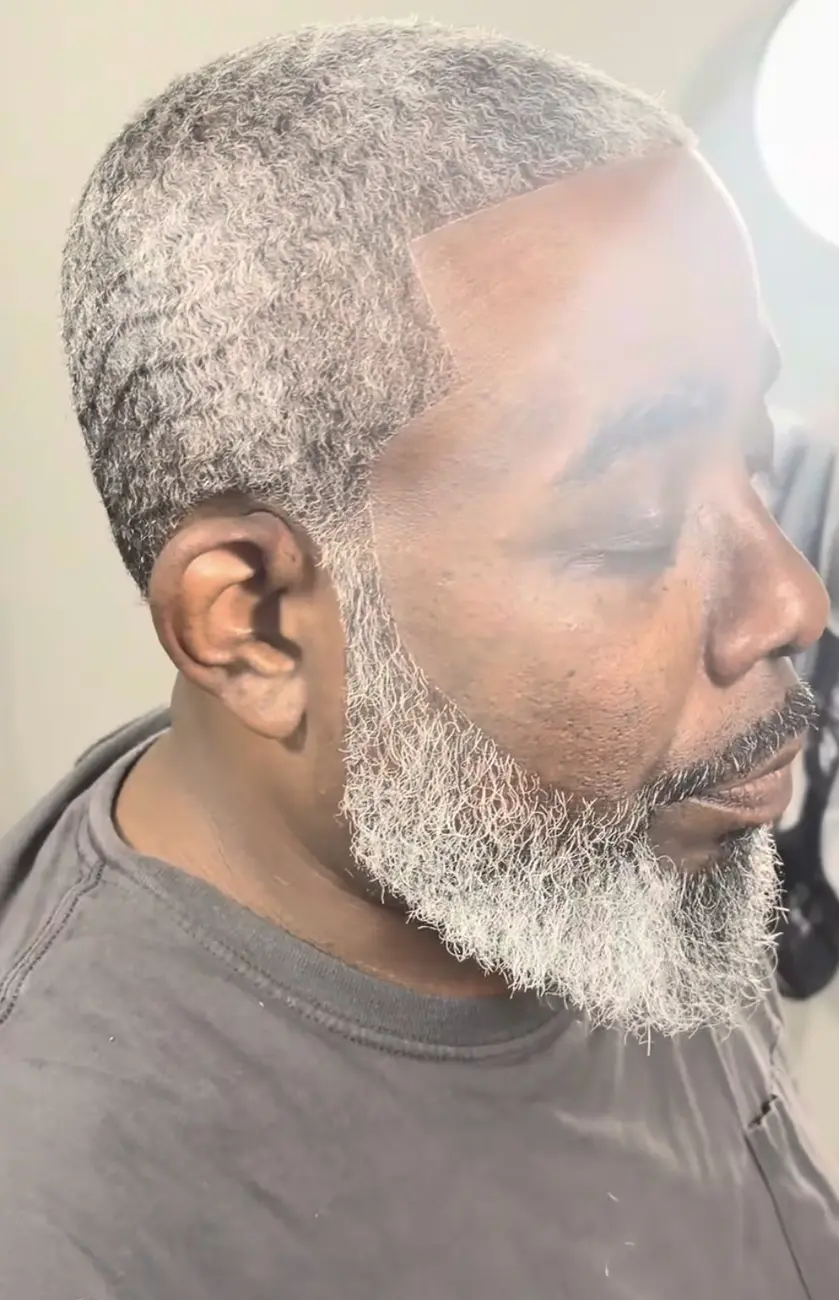 Sharp temple line and shaped silver beard