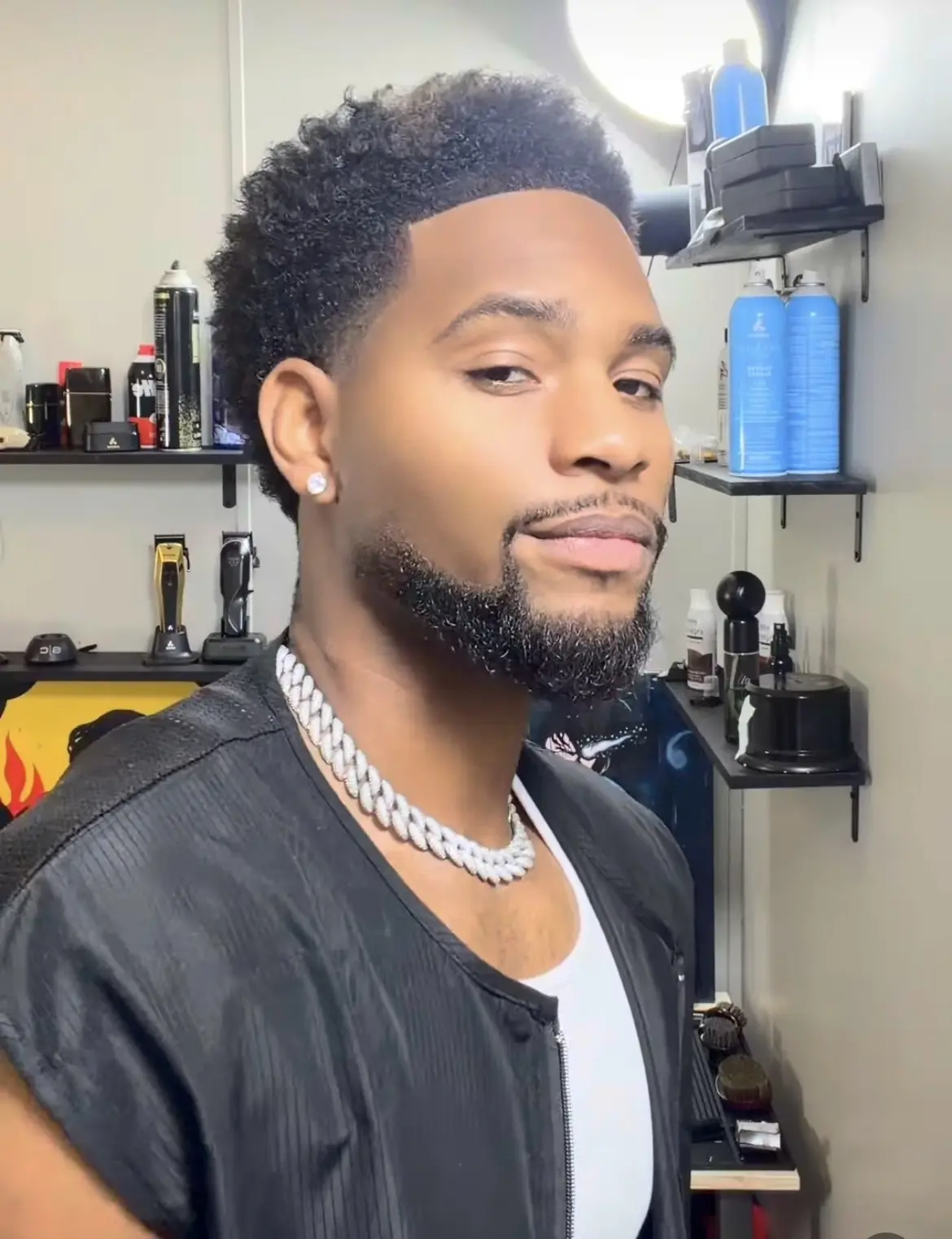 Damon in his private studio wearing a Cuban link chain after a fresh cut